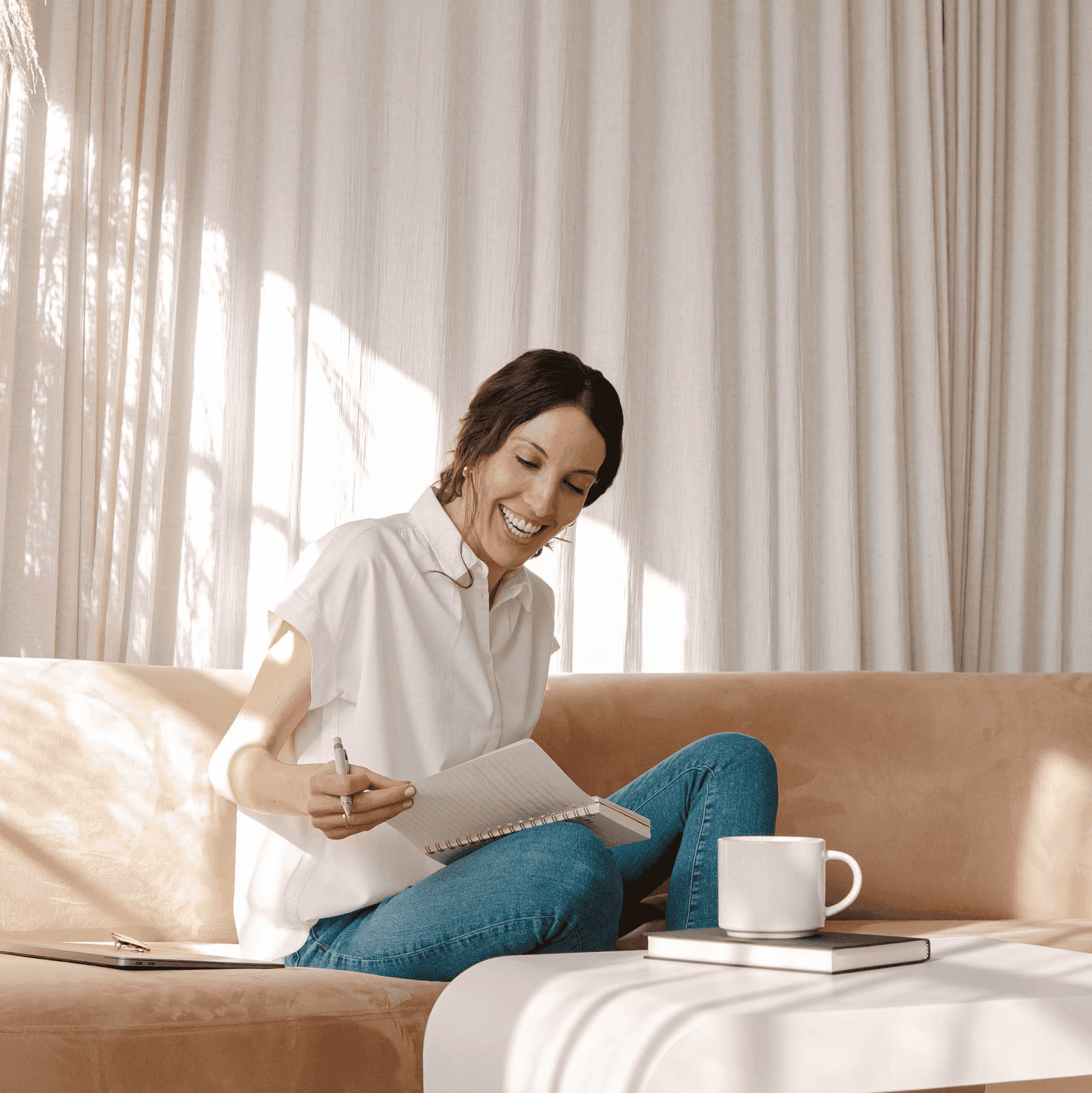 Lady reading book on couch