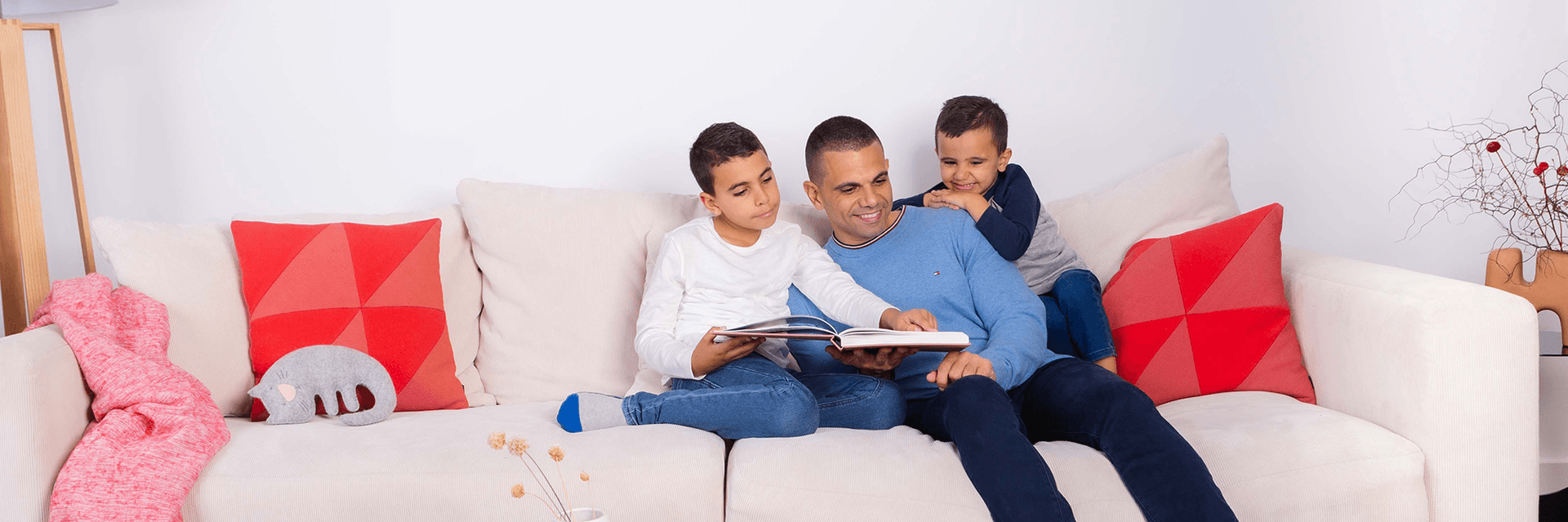 father with two kids reading