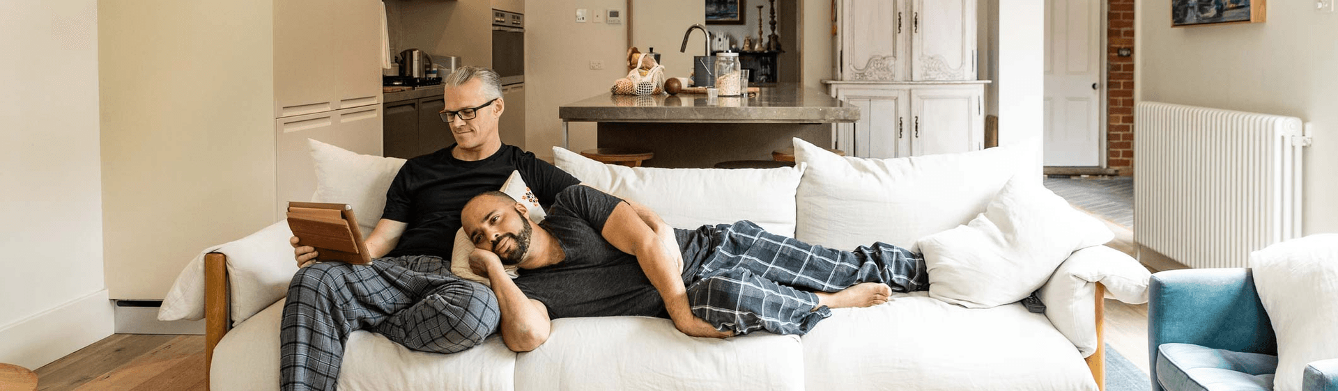 male couple relaxing on the sofa