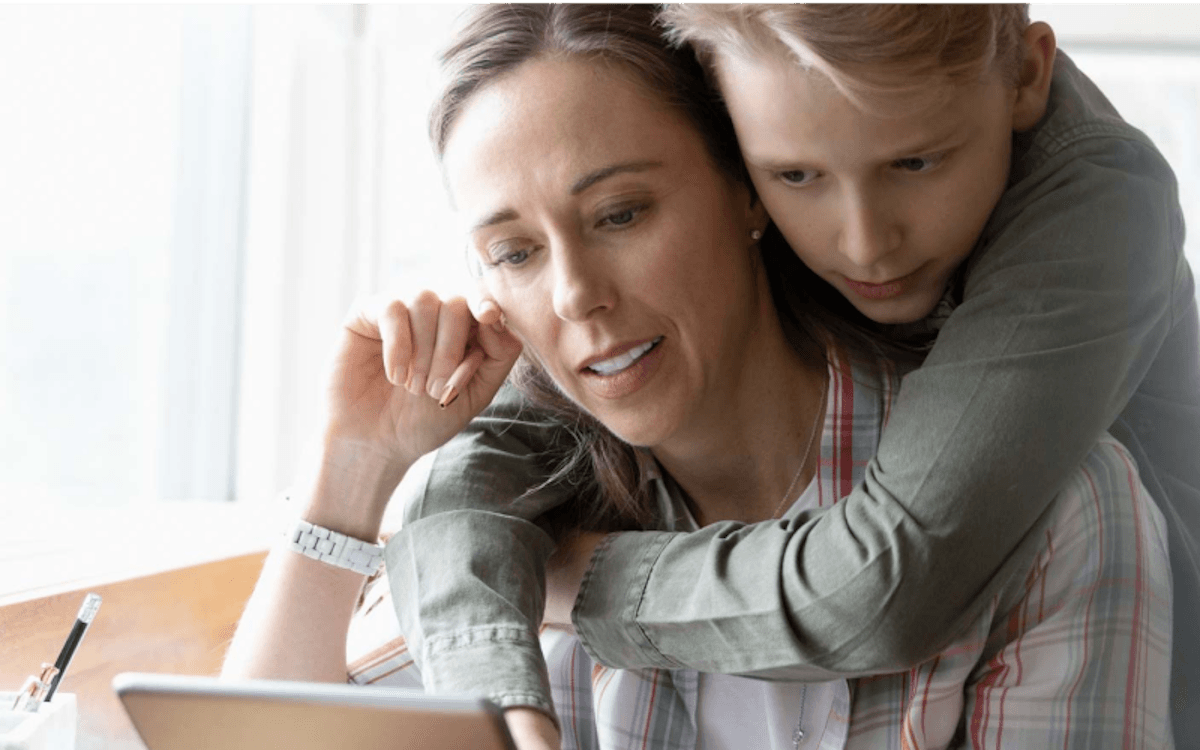 mother and son looking at ipad